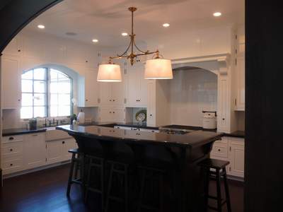White Kitchen Island on White Cabinets With Inset Doors And Mortise Hinges Contrast With A
